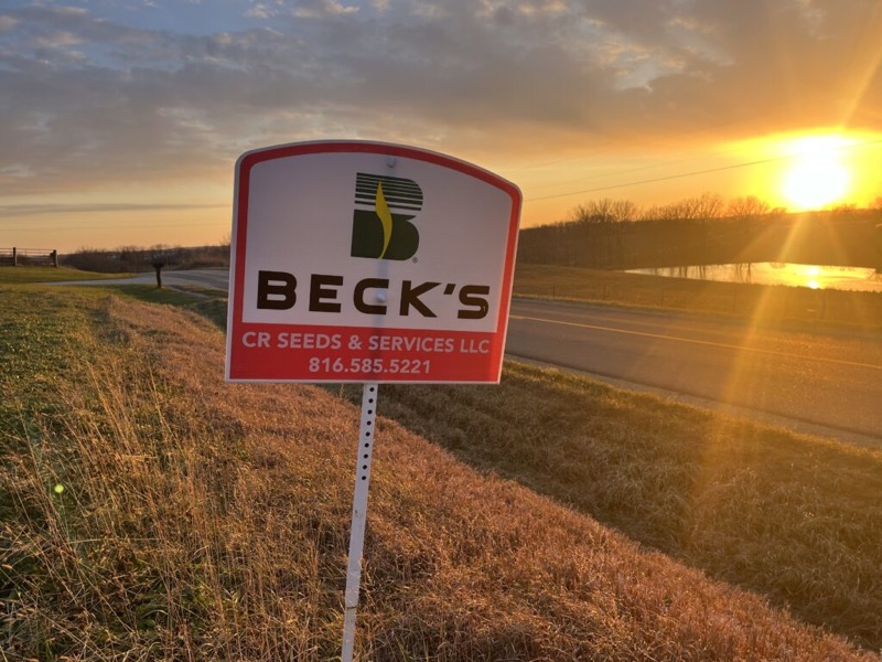 A Beck’s CR Seeds & Services sign at sunrise