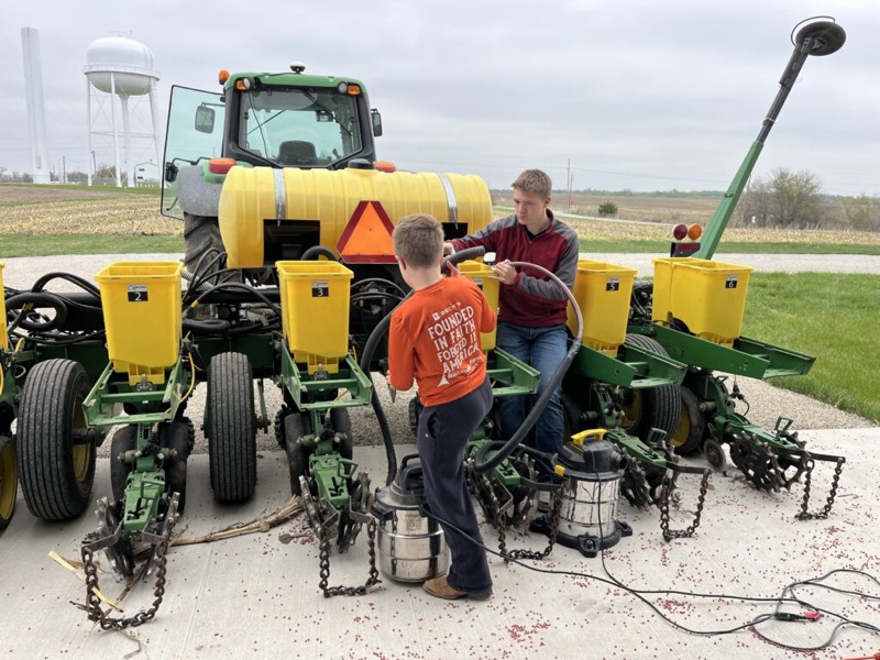 Cleaning out the seed boxes on a planter