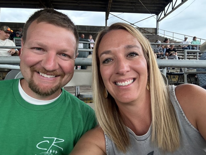 Cory Robinson and his wife at an outdoor event