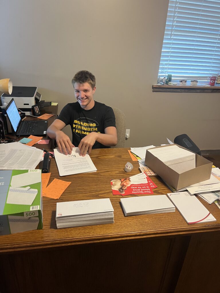 Working at the desk in the CR Seeds & Services office