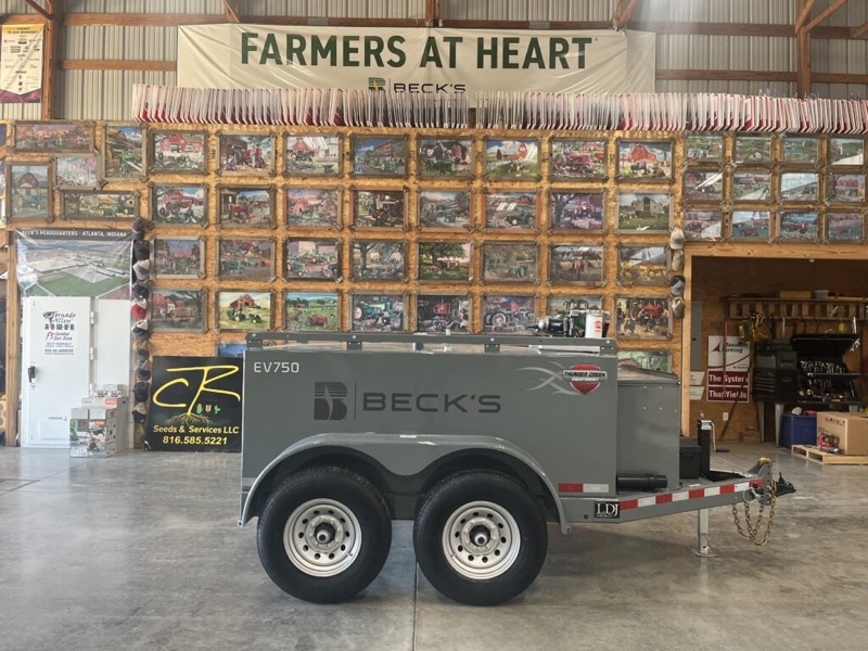 The Wall of Puzzles under the Farmers at Heart banner, with a Beck’s fuel trailer